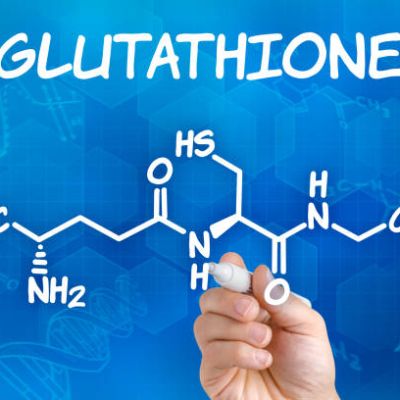 Hand with pen drawing the chemical formula of Glutathione